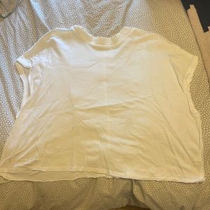Cropped white T-shirt with a low turtle neck